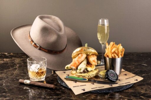 Indulge in the £1,400 1876 Burger Experience at Montage Deer Valley, featuring A5 Wagyu, caviar, and a gold-leaf bun, plus a custom cowboy hat from Burns Saddlery.