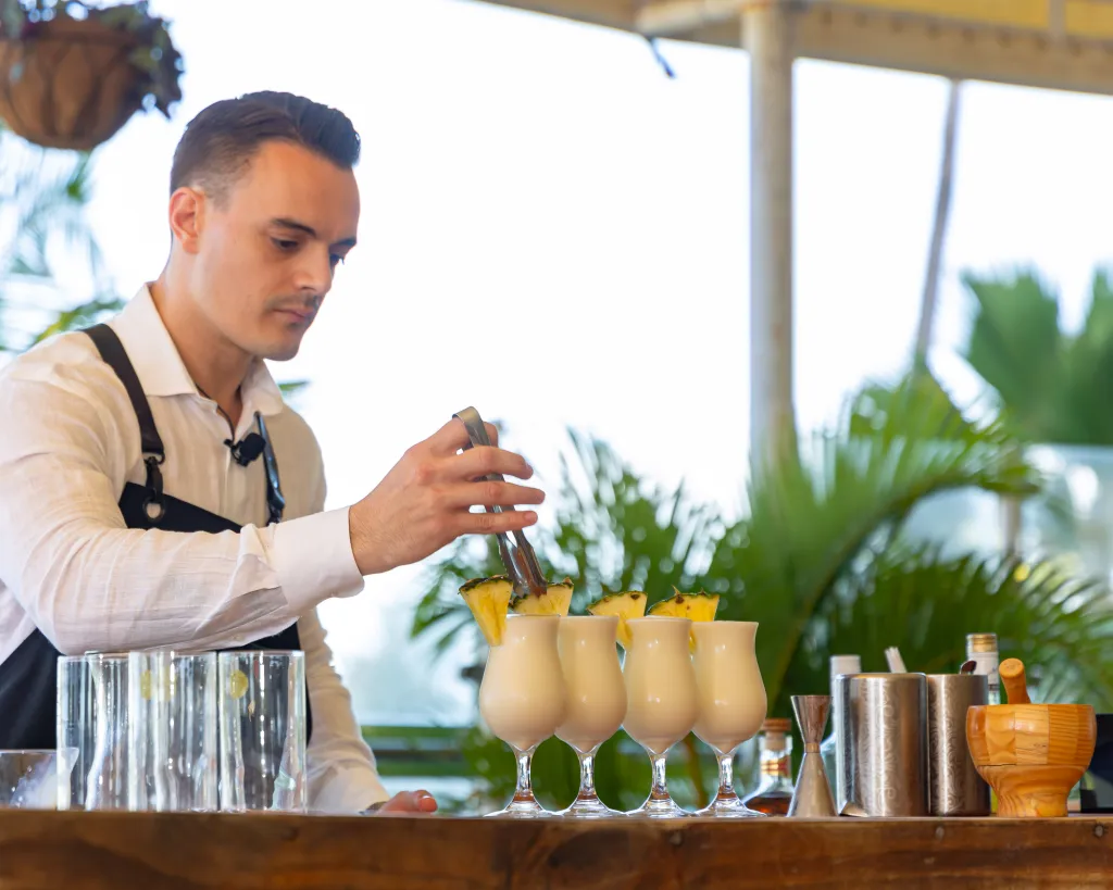 A Hilton survey reveals 96% of Americans feel relaxed with a Piña Colada, yet only 35% order it outside vacation. Discover why this tropical drink is a holiday favorite.