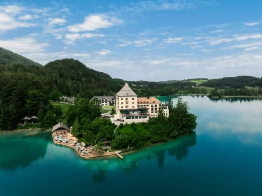 Nestled by Lake Fuschl and the Austrian Alps, Rosewood Schloss Fuschl offers a luxurious retreat. This 15th-century castle reimagines heritage with modern elegance, sustainable practices, and unique cultural experiences.