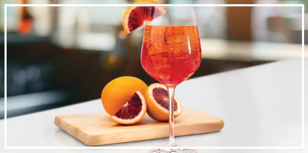Celebrate summer with Hilton Garden Inn's new Rossa Garden Spritz, a refreshing twist on the classic Aperol spritz with zesty blood orange, available at Garden Grille locations nationwide.