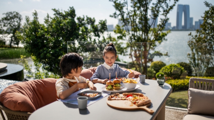 Experience a tranquil summer retreat at Four Seasons Hotel Suzhou, where private islands, lush bamboo groves, and the aroma of lotus blossoms create an idyllic escape.