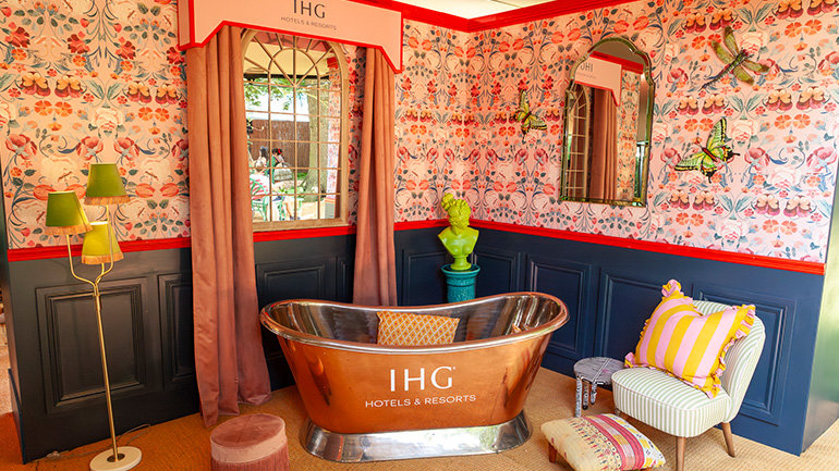 IHG Hotel in the Wild returned to Wilderness Festival, offering whimsical hospitality for festival-goers and celebrities. Inspired by British culture, this pop-up featured luxury and festive twists.