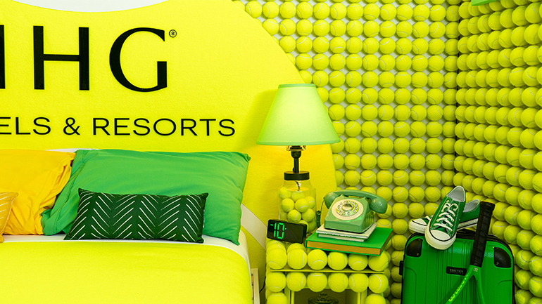 IHG Hotels & Resorts partners with the US Open for the sixth year, unveiling the 'IHG Rally Room,' a tennis-themed suite inspired by the debate on whether tennis balls are green or yellow.