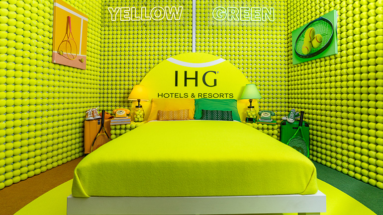 IHG Hotels & Resorts partners with the US Open for the sixth year, unveiling the 'IHG Rally Room,' a tennis-themed suite inspired by the debate on whether tennis balls are green or yellow.