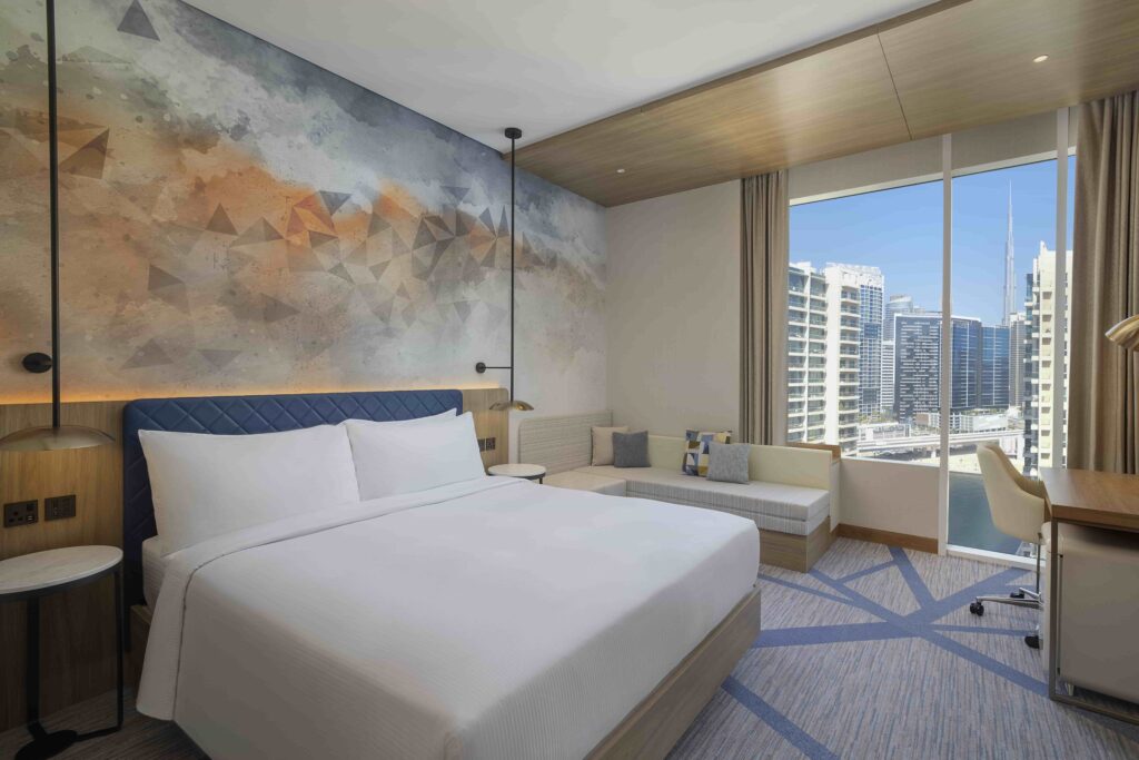 Hilton expands its UAE portfolio with the debut of Embassy Suites by Hilton and the opening of Hilton Garden Inn in Dubai Business Bay, offering luxury accommodations and prime city access.