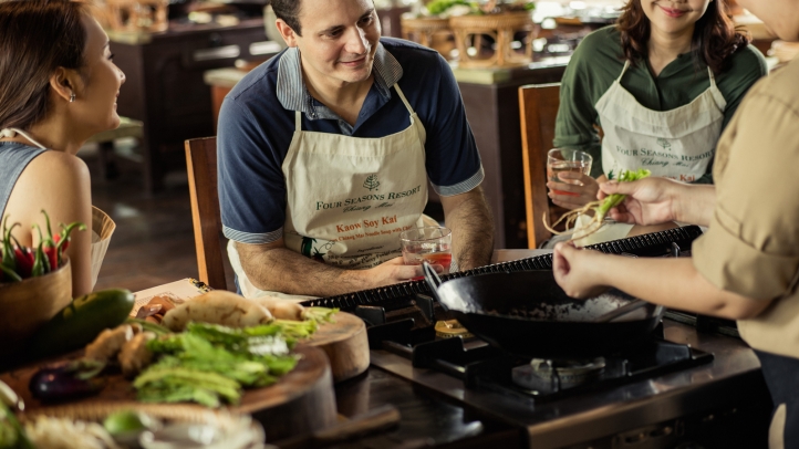 At Rim Tai Kitchen at Four Seasons Resort Chiang Mai, guests embark on an interactive culinary journey, exploring authentic Thai flavors with hands-on cooking classes led by expert chefs.