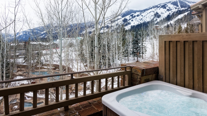 Experience luxury at Four Seasons Jackson Hole with private retreats, ski-in/ski-out access, Santa visits, and exclusive family amenities this holiday season.