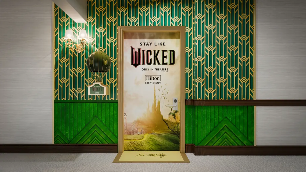 Hilton and Universal Pictures introduce the exclusive "Stay Like Wicked" suite at New York Hilton Midtown, offering a magical, film-inspired experience from Nov 21, 2024, to Jan 5, 2025.