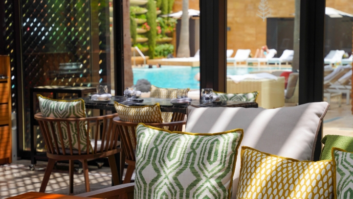 Kyúb at Four Seasons Hotel Casablanca offers a luxurious dining experience with coastal cuisine and Latin American influences, crafted by Chef Aleksandr Gaitsuk in a serene garden setting.