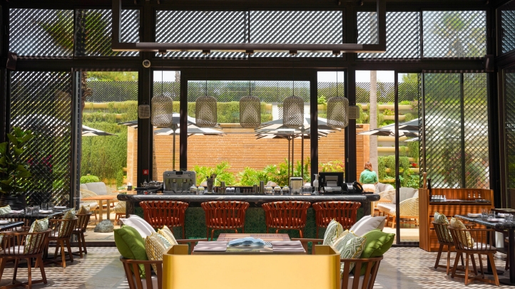 Kyúb at Four Seasons Hotel Casablanca offers a luxurious dining experience with coastal cuisine and Latin American influences, crafted by Chef Aleksandr Gaitsuk in a serene garden setting.