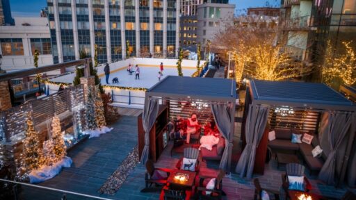 Experience festive cheer at Four Seasons Hotel Baltimore's Winter Village, featuring a rooftop skating rink, seasonal treats, cozy cabanas, and stunning harbor views.