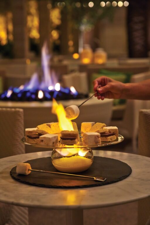 Experience holiday magic at Four Seasons Las Vegas with Sugarplum Social on the PRESS Patio, featuring Nutcracker-inspired cocktails, s’mores by firepits, and festive charm.