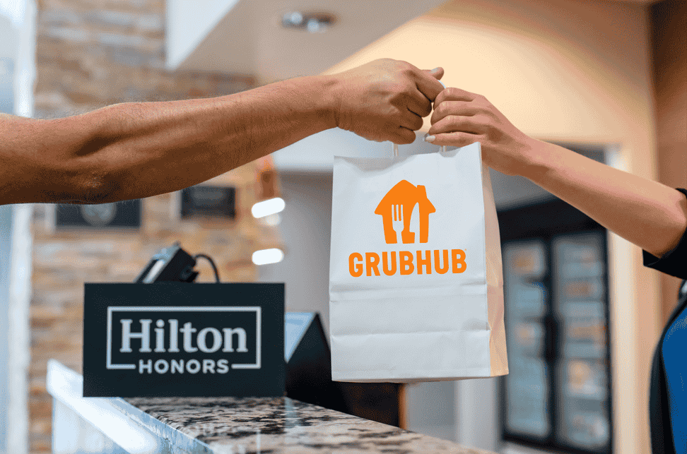 Grubhub and Hilton expand their partnership to offer seamless mobile ordering and delivery at 2,600+ hotels, enhancing guest convenience with food, essentials, and perks.