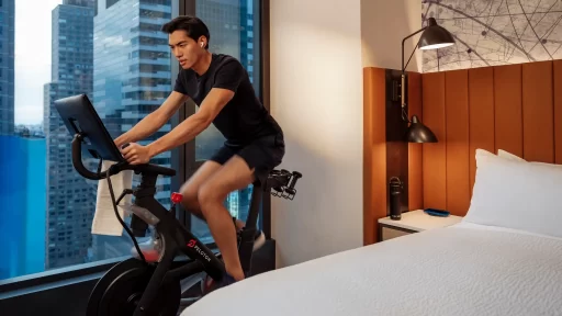 Hilton and Peloton partner to offer in-room fitness classes via Connected Room, letting travelers maintain wellness routines with on-demand yoga, cardio, strength, and more.