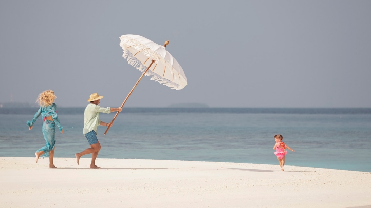 Four Seasons Maldives offers purpose-driven family escapes with marine programs, surfing, private villas, and activities designed to inspire all ages in a stunning island setting.